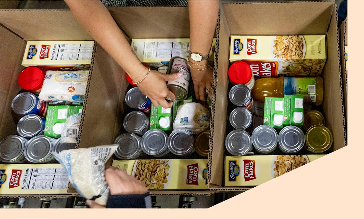 Workers pack boxes for a Commodity Supplemental Food Program 