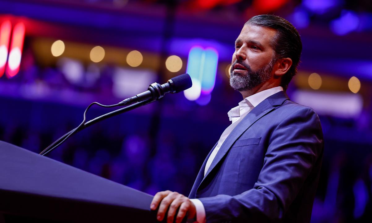 Donald Trump Jr speaking at a podium