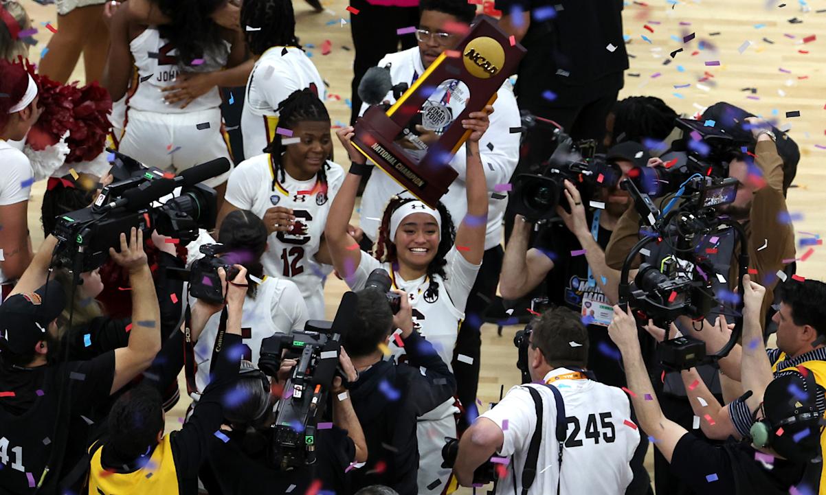 South Carolina Gamecocks hoists the trophy after beating the Iowa Hawkeyes in the 2024 NCAA Women's Basketball Tournament National Championship