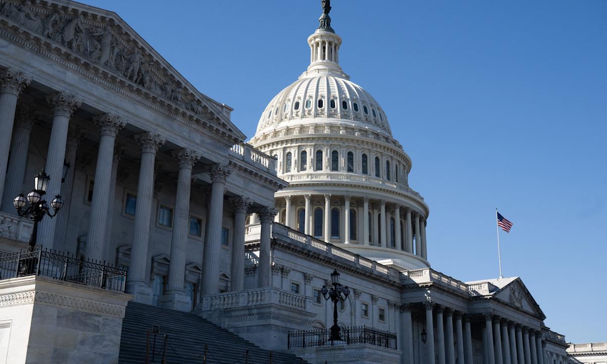  US flag flies near the dome of the US Capitol in Washington, DC, February 25, 2025. 