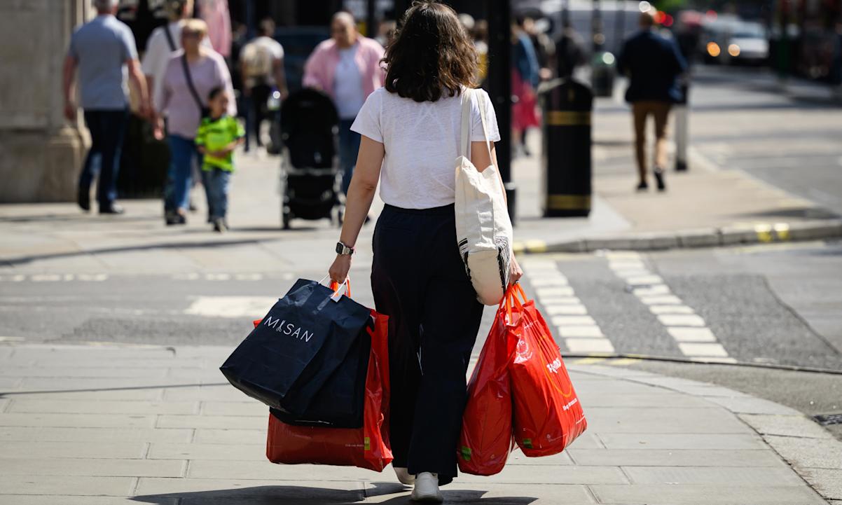 woman with overflowing shopping bags