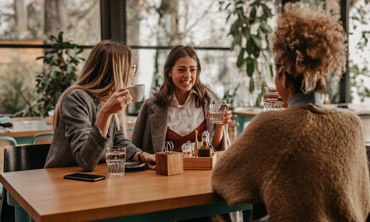 Three friends at a table