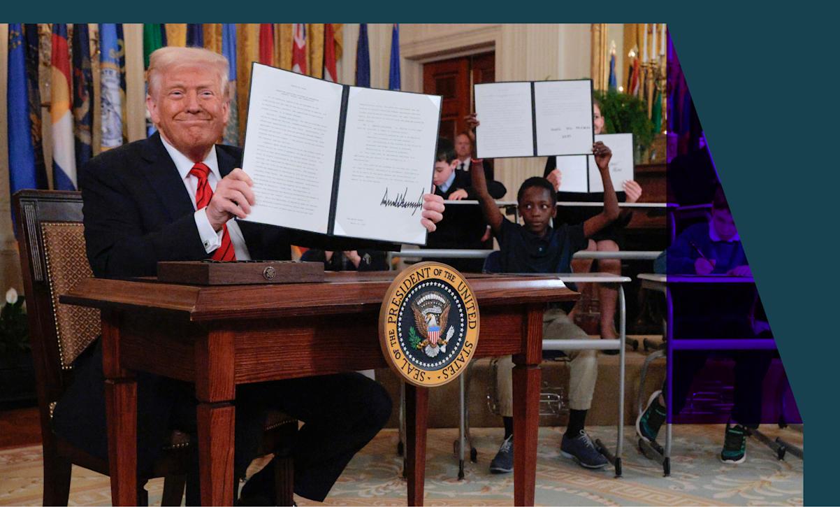 President Donald Trump holding an executive order 