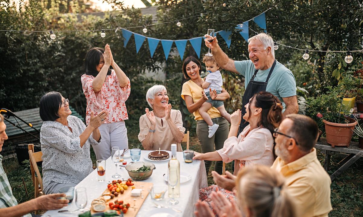 Family birthday celebration outdoors