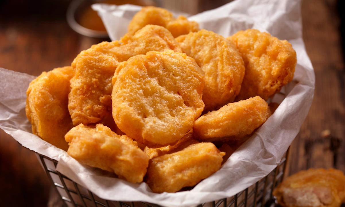 Golden chicken nuggets in a basket 