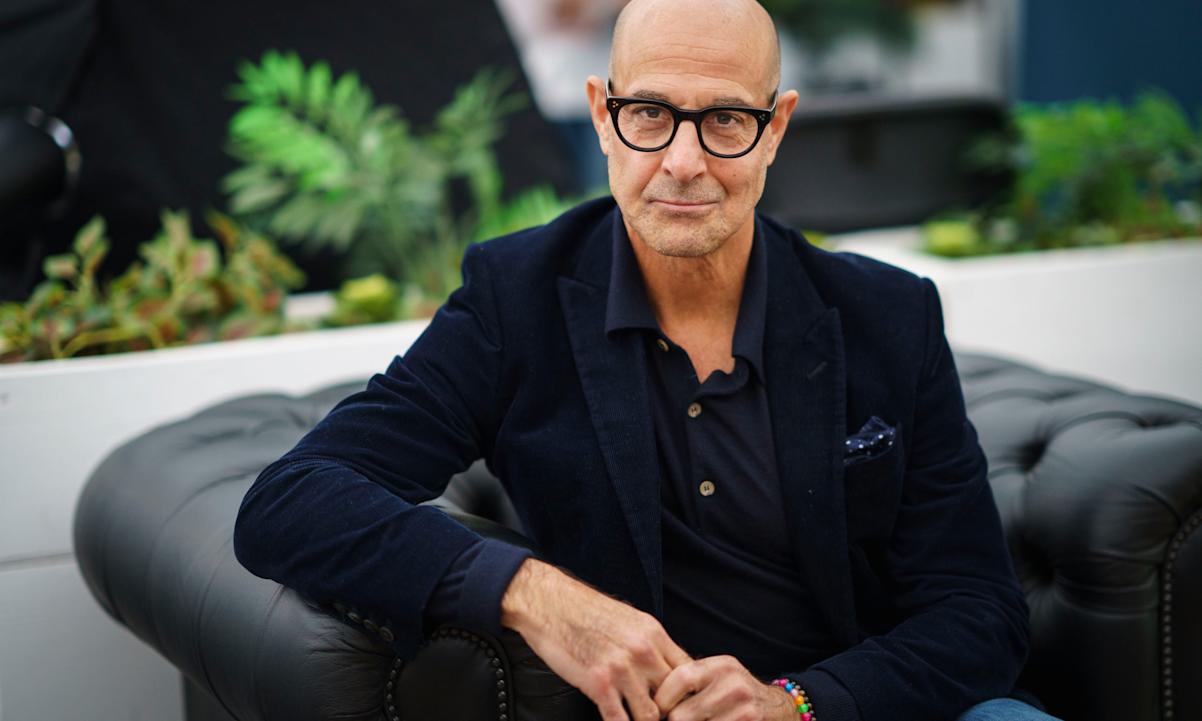 Stanley Tucci on a couch