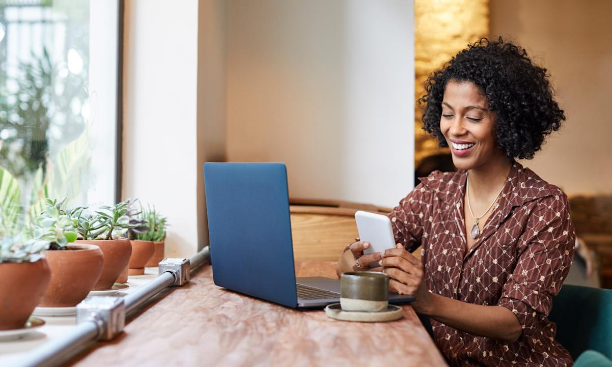 Woman on phone in a coffee shop.