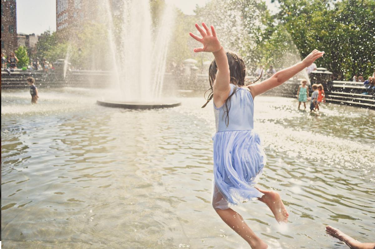 Kid playing in fountain