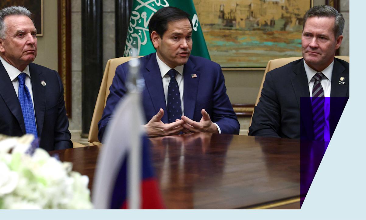 US Secretary of State Marco Rubio in a blue suit at a table amid a meeting with Russia