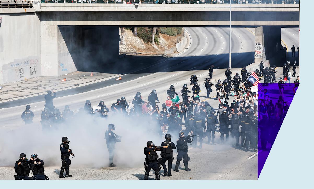 Protesters and law enforcement standing off on the 101 freeway in LA